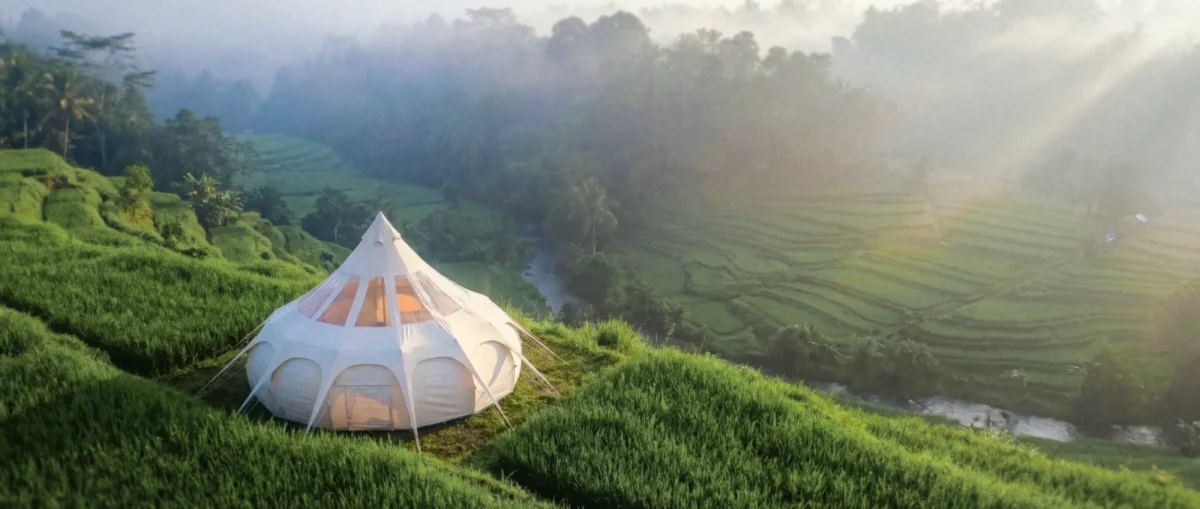 Luxury dome tent on Bali rice terrace at sunrise